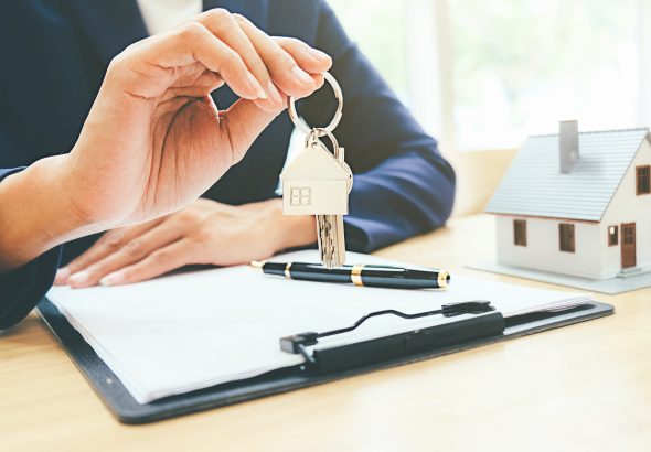 House,Model,With,Real,Estate,Agent,And,Customer,Discussing,For
